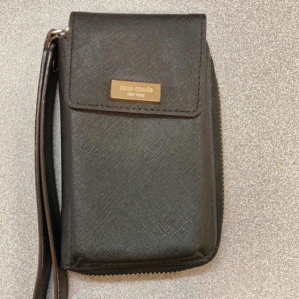 Gently used Kate Spade wallet/phone holder wristlet.     4 slots for cards.